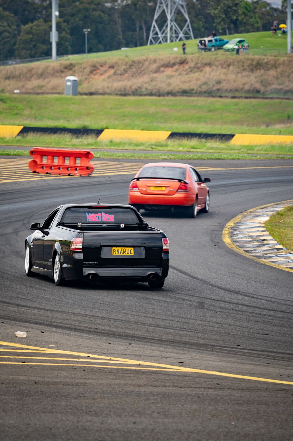 Black and orange car on the race track