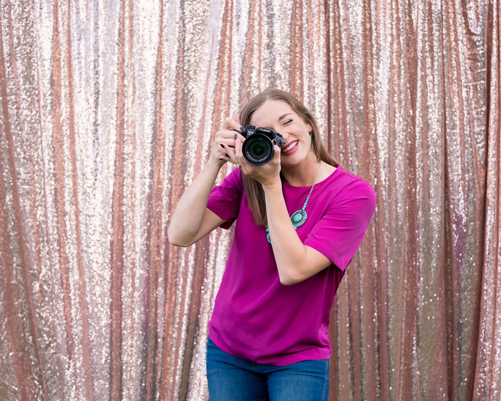 Sparkly rose gold sequin backdrop creates glamorous photo background.