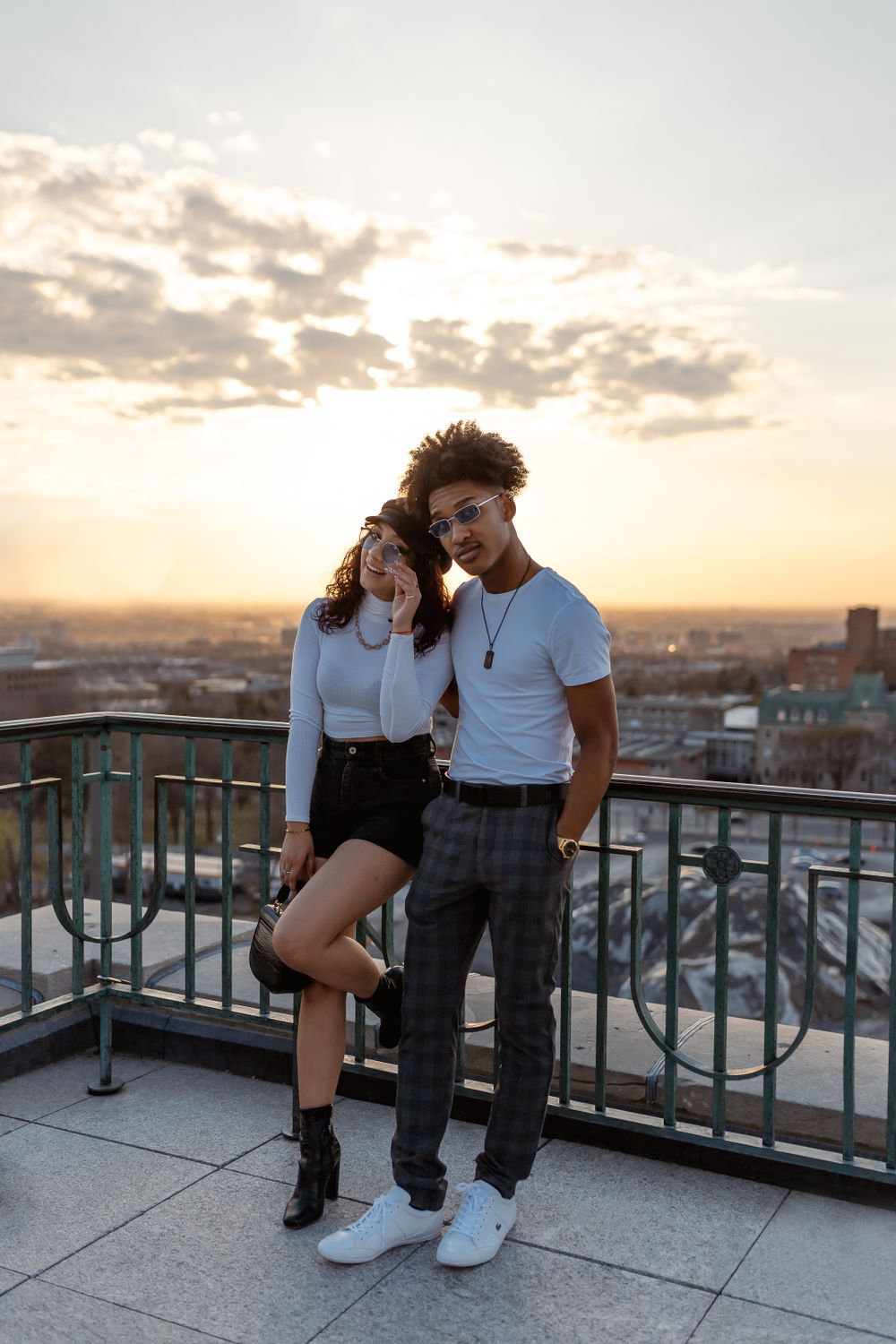 Fashion couple at sunset on rooftop