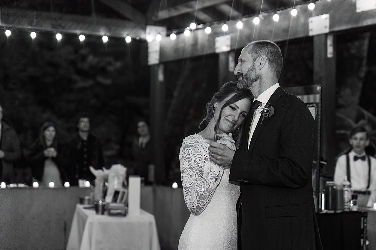 Photography of father and daughter hugging during dance at wedding