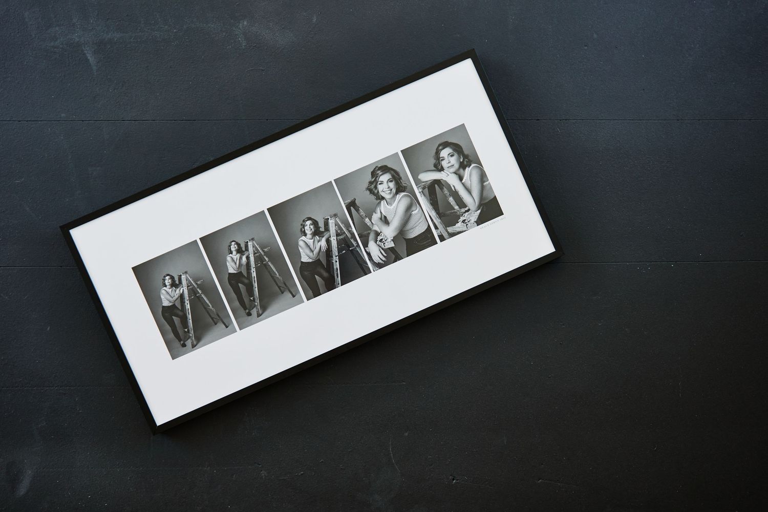 Black and white film strip negatives displayed on a dark background showing sequential portrait shots.