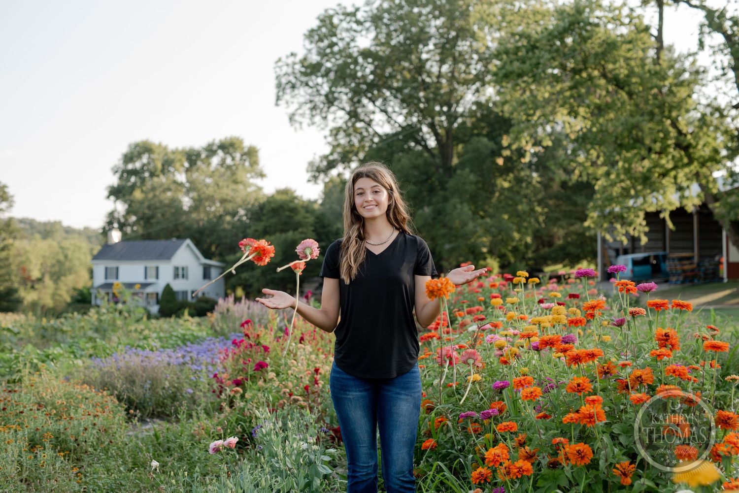 Garden portrait with orange and pink flowers during golden hour.