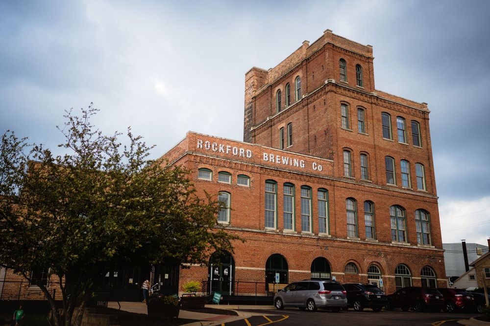 Historic brick building with Rickhouse Brewing Co signage under cloudy sky.