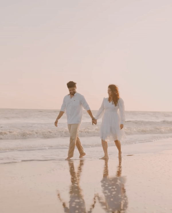 wedding photographer in london capturing couple walk at beach