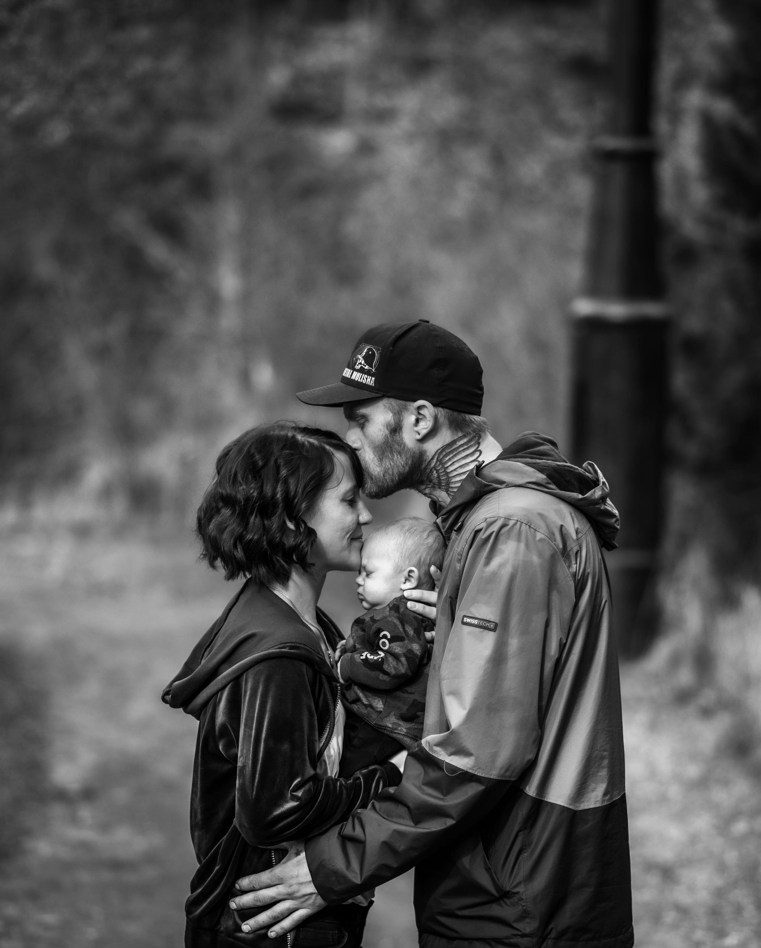 Black and white portrait series capturing intimate moments between couples.