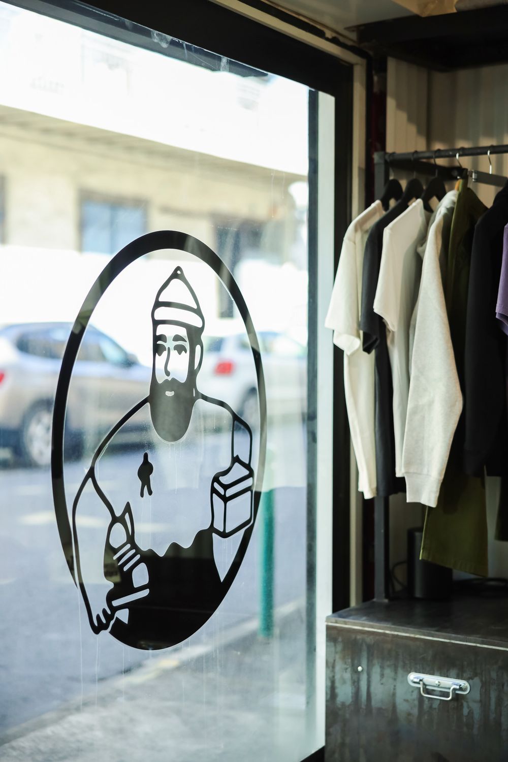 Silhouette decals of construction workers displayed on storefront windows.