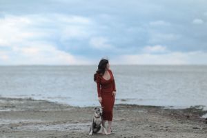 Women and a dog on the beach in Connecticut