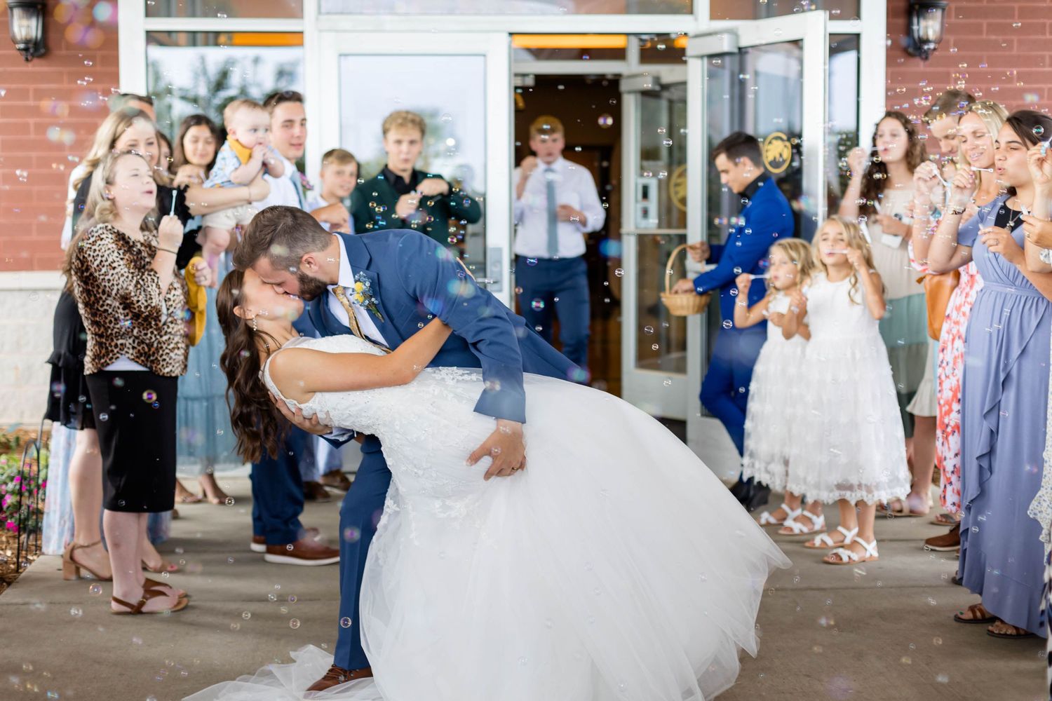 bubble exit groom dips the bride