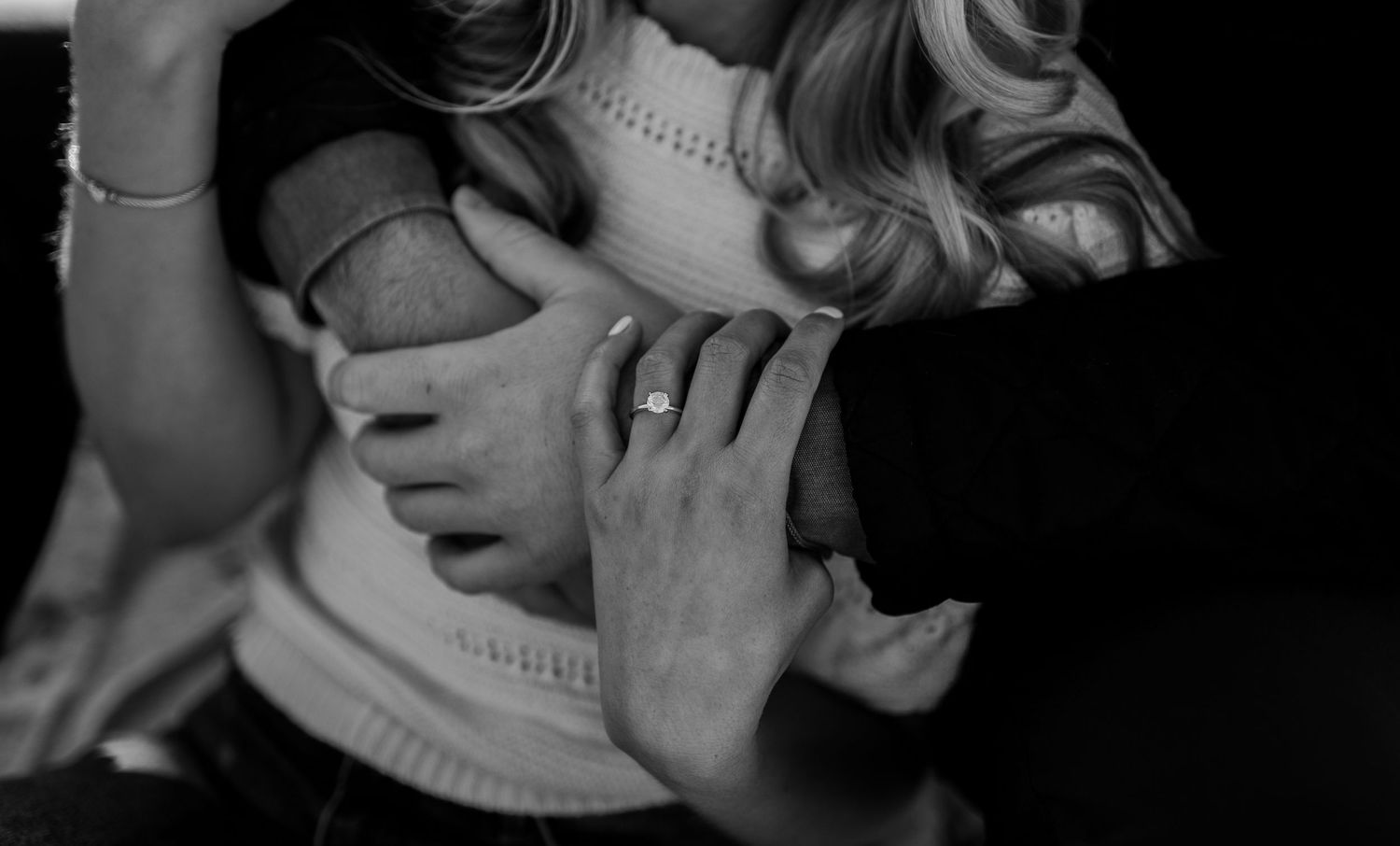 Close-up black and white images capture intimate moments between a couple.