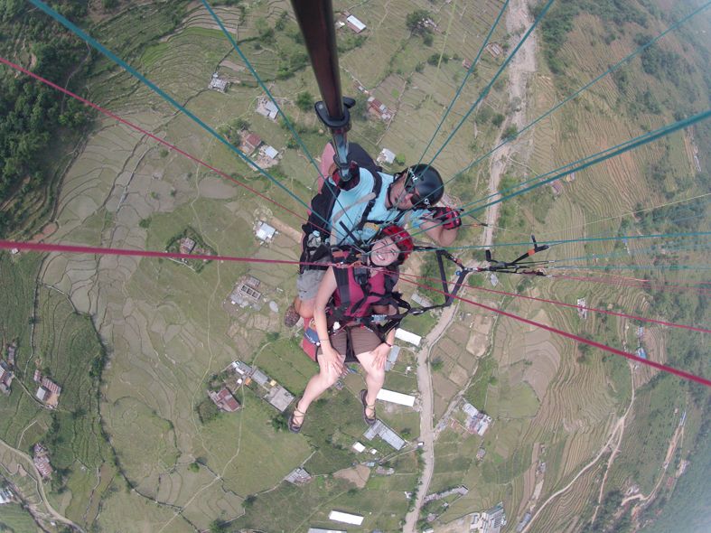 Leah Ramuglia paragliding in the Annapurna Conservation Area and mountains in Nepal