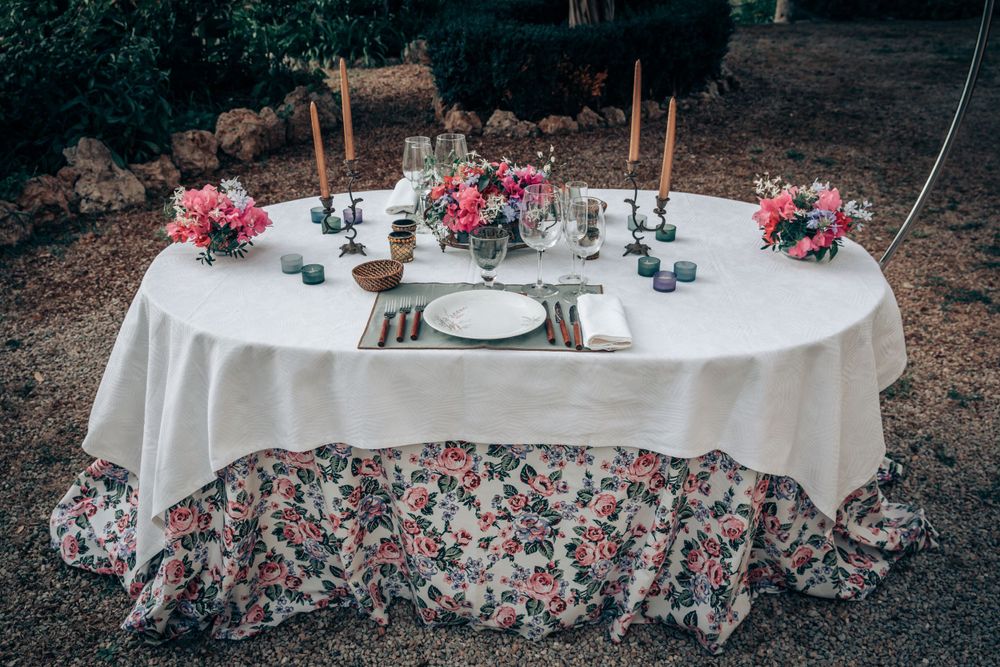 An elegant outdoor reception table setup for an intimate luxury micro wedding dinner in Mallorca.