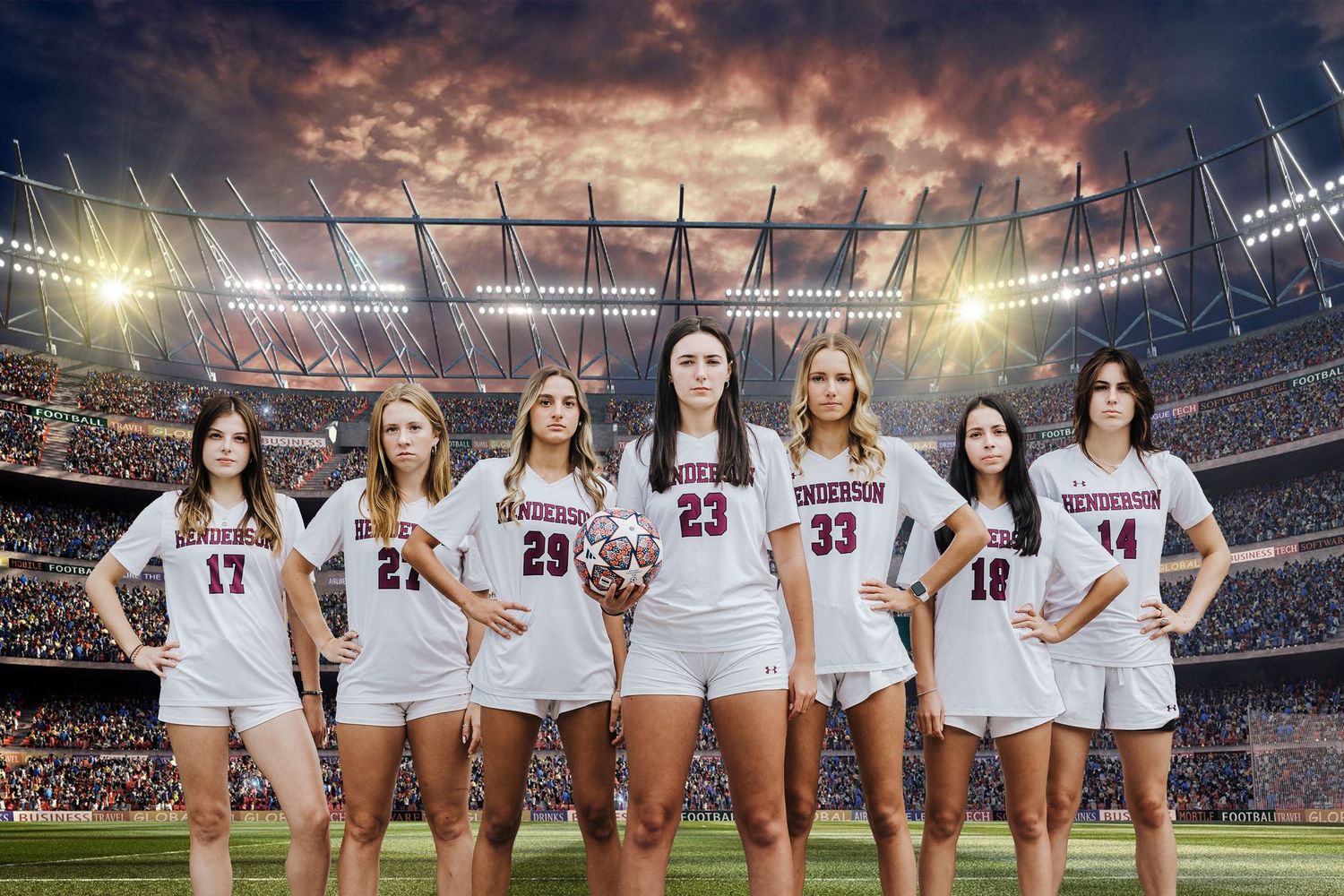 Athletic team members in white uniforms standing in stadium with dramatic sunset sky backdrop.
