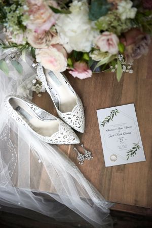 Flat lay photo of wedding items by Anguelo Photography