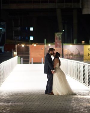 Portrait of a bride and groom kissing at night by Anguelo Photography