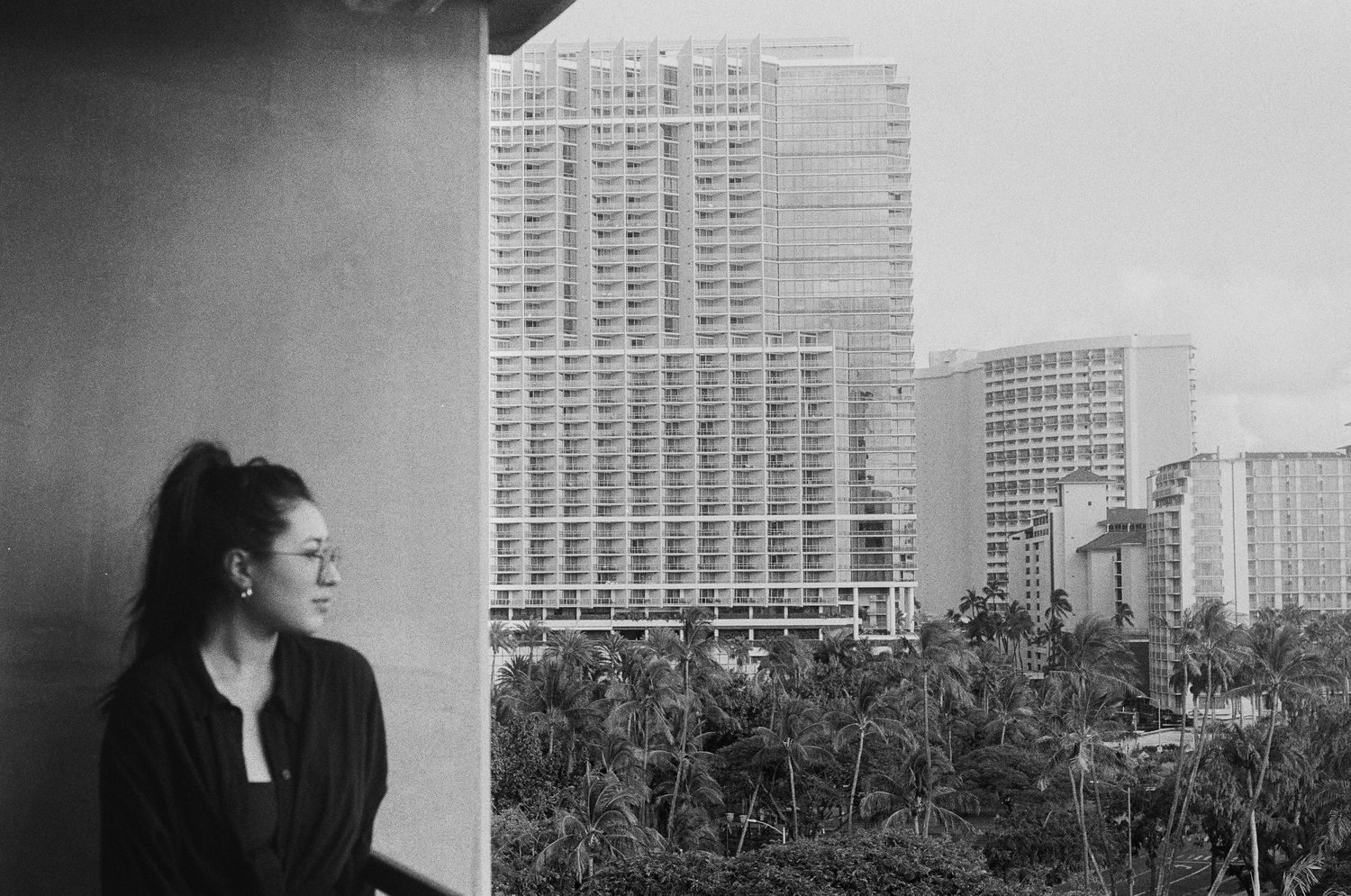 Grainy black and white side profile photo of Felix, captured candidly in soft, natural light.”