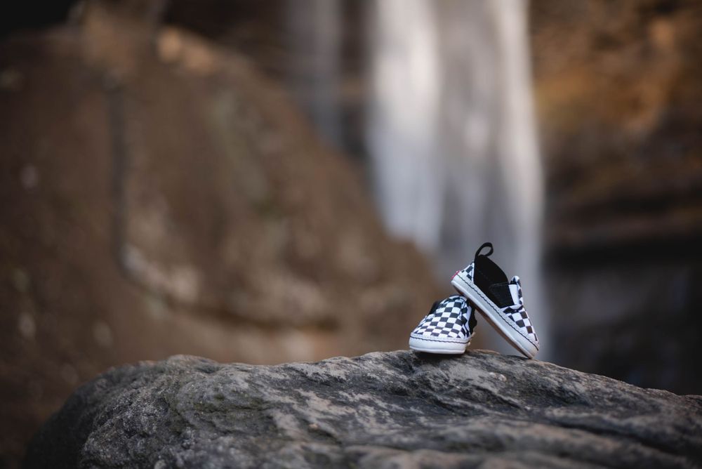 Maternity portrait session of baby Vans shoes