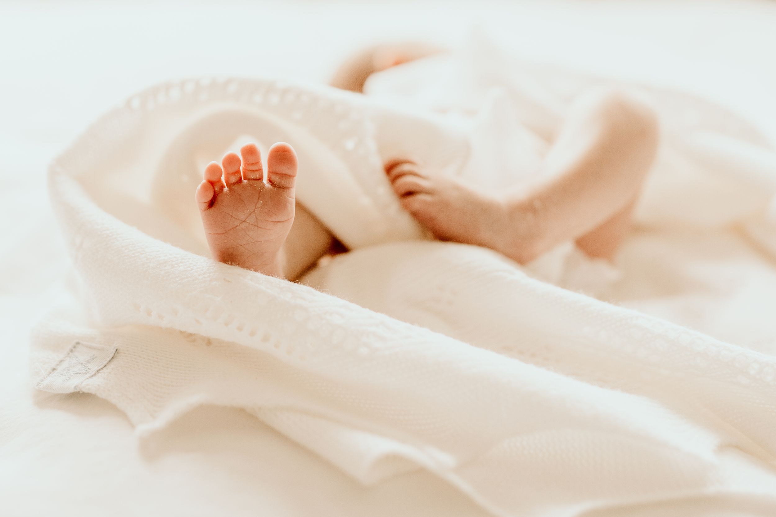 Bishops Stortford baby photographer, Hertfordshire, newborn baby feet wrapped up in blanket. natural baby photos