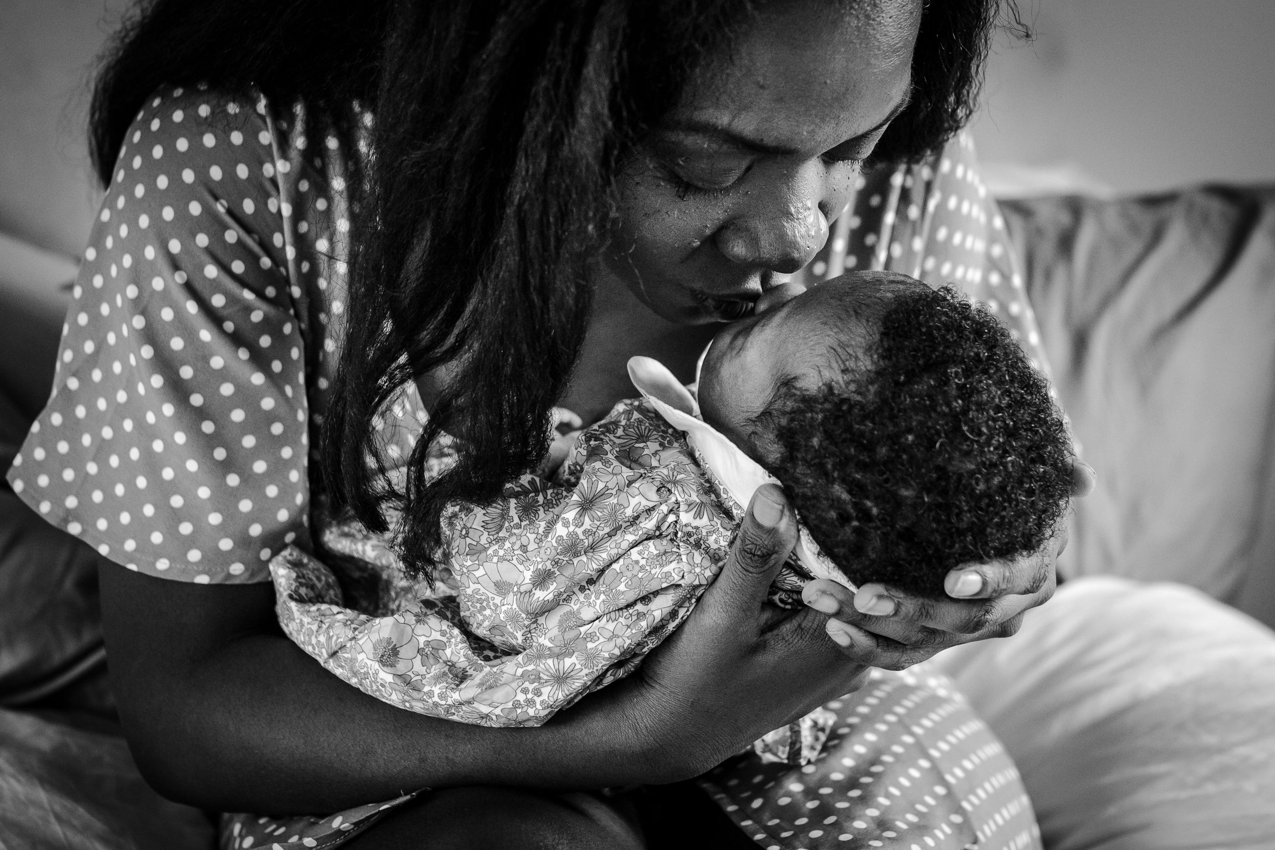 Bishops stortford baby photographer, Hertfordshire, close up of new mum giving her newborn baby a kiss