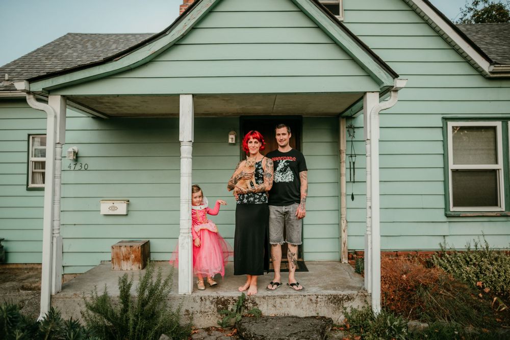 queer family poses for photo on front porch family photographer portland oregon