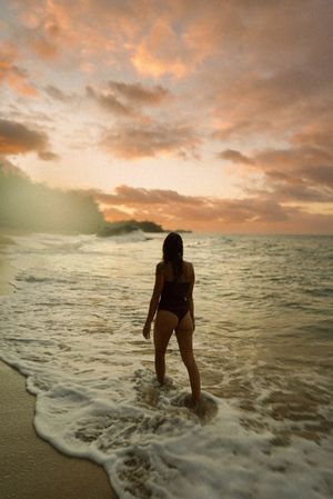 walking the beach we call, tourist lumahai with the clouds emitting beautiful hues during a sunset