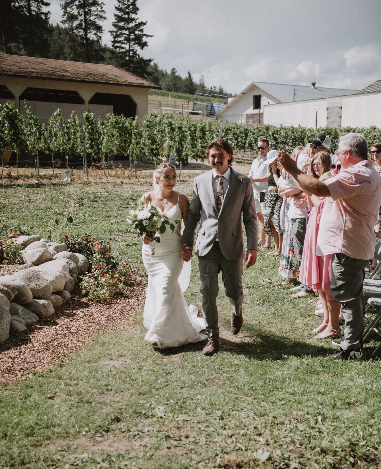 Bride and groom walking down the aisle together after being married!
