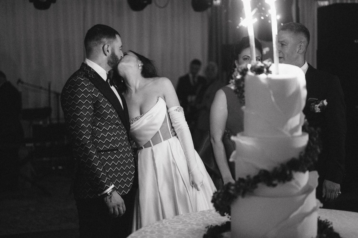 Wedding couple shares an intimate dance moment at their reception in black and white.