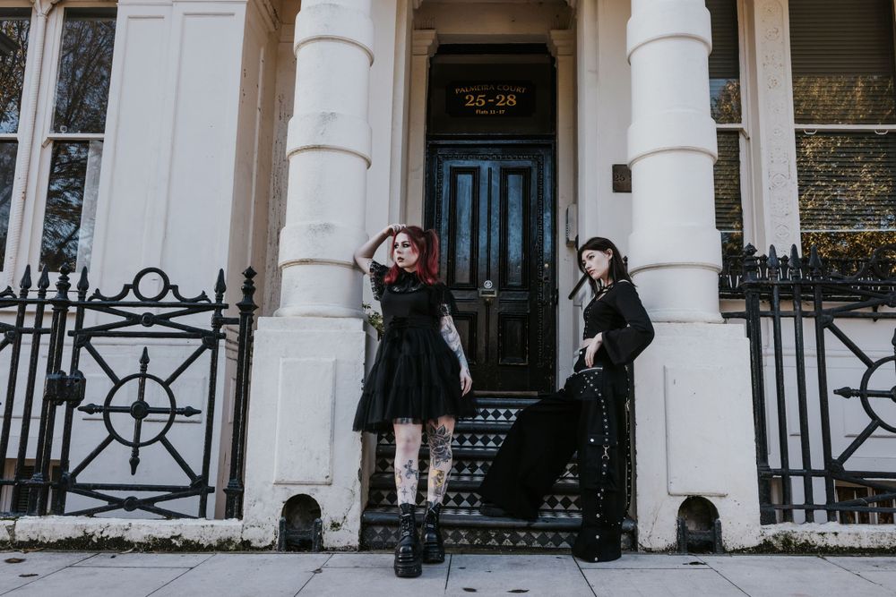 Gothic styled alternative models posing outside a white & black building in Hove for a small fashion brand