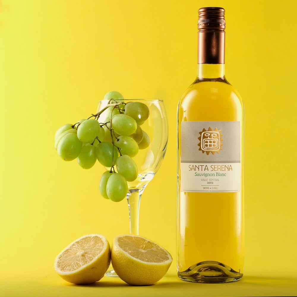 e-Commerce shot of a bottle of 2012 Santa Serena Sauvignon Blanc on a bright yellow background.