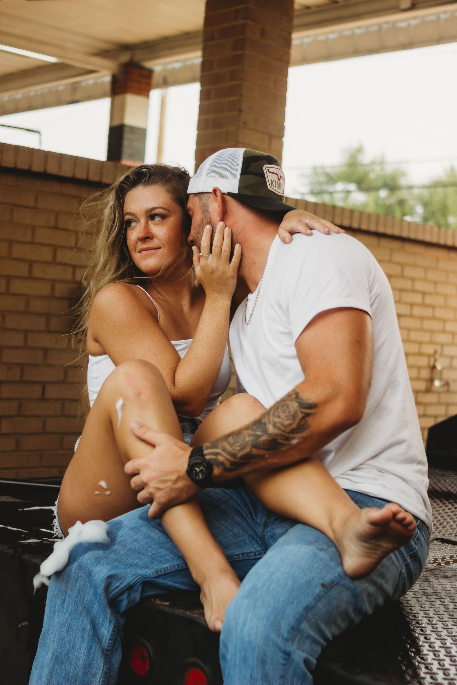 couple embracing in carwash