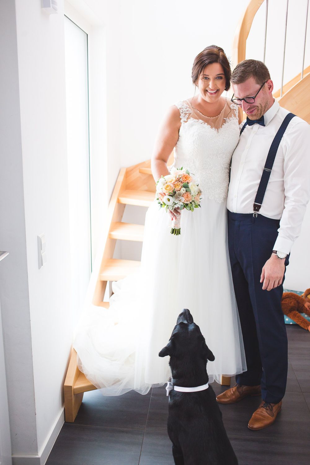 bride and groom with their dog