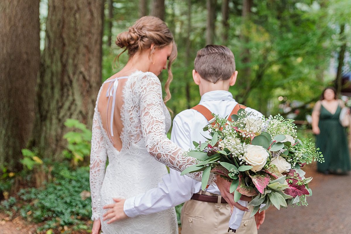 Sweet moment of bride and brother walking at wedding