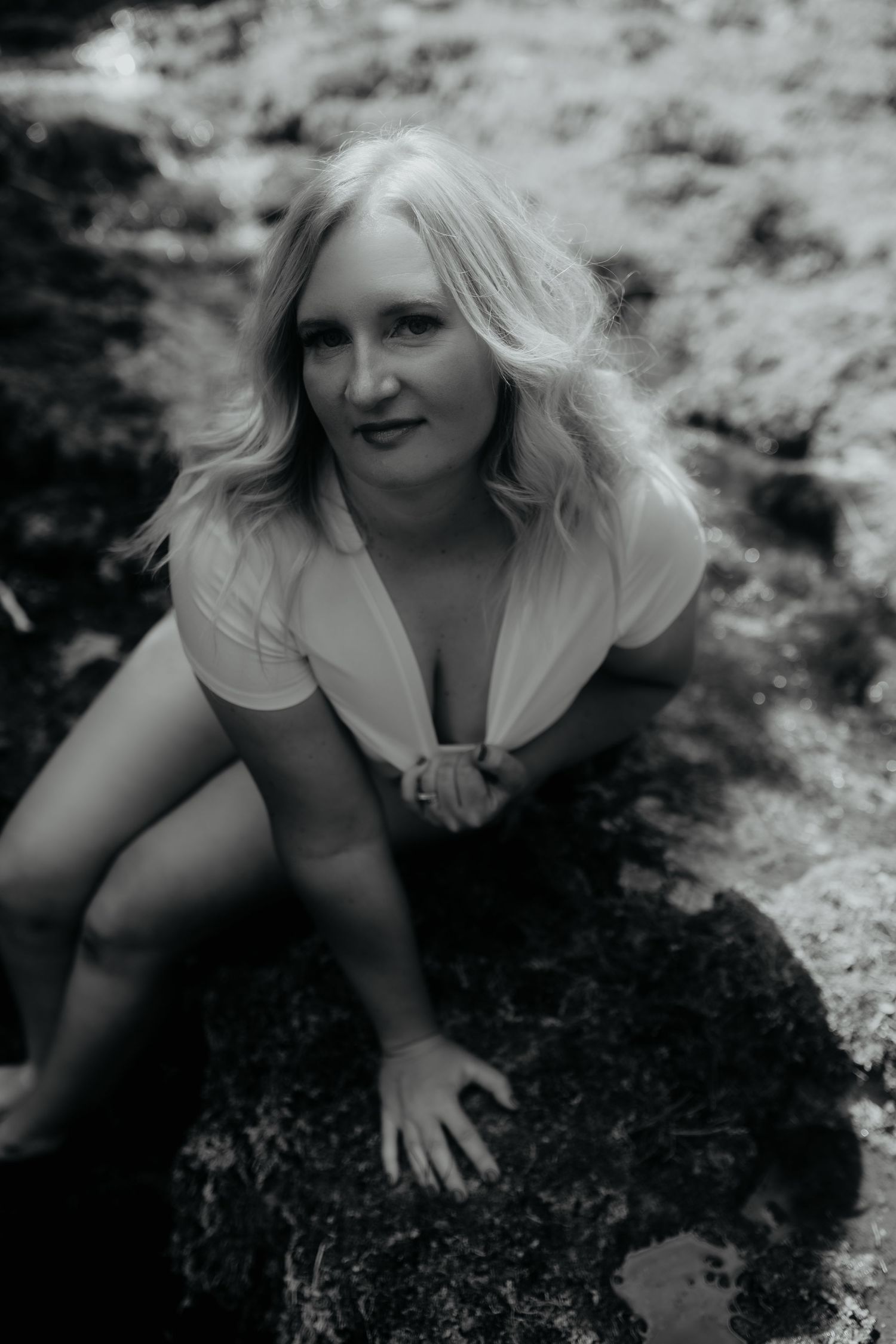 Woman looking up posing for boudoir photoshoot from sweet confidence boudoir.