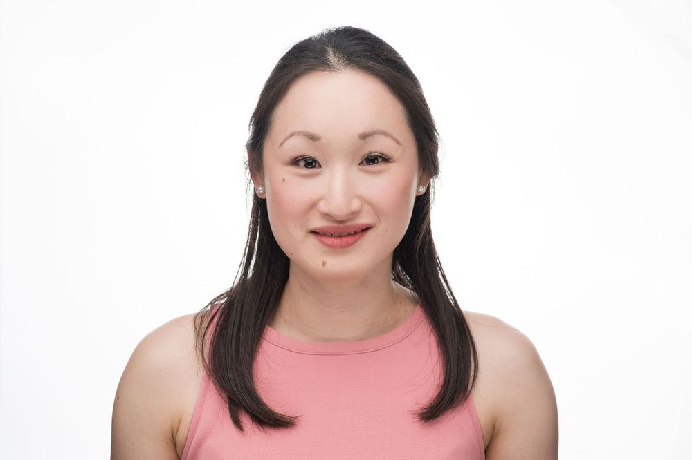 Portrait of someone wearing a pink top against a white background.
