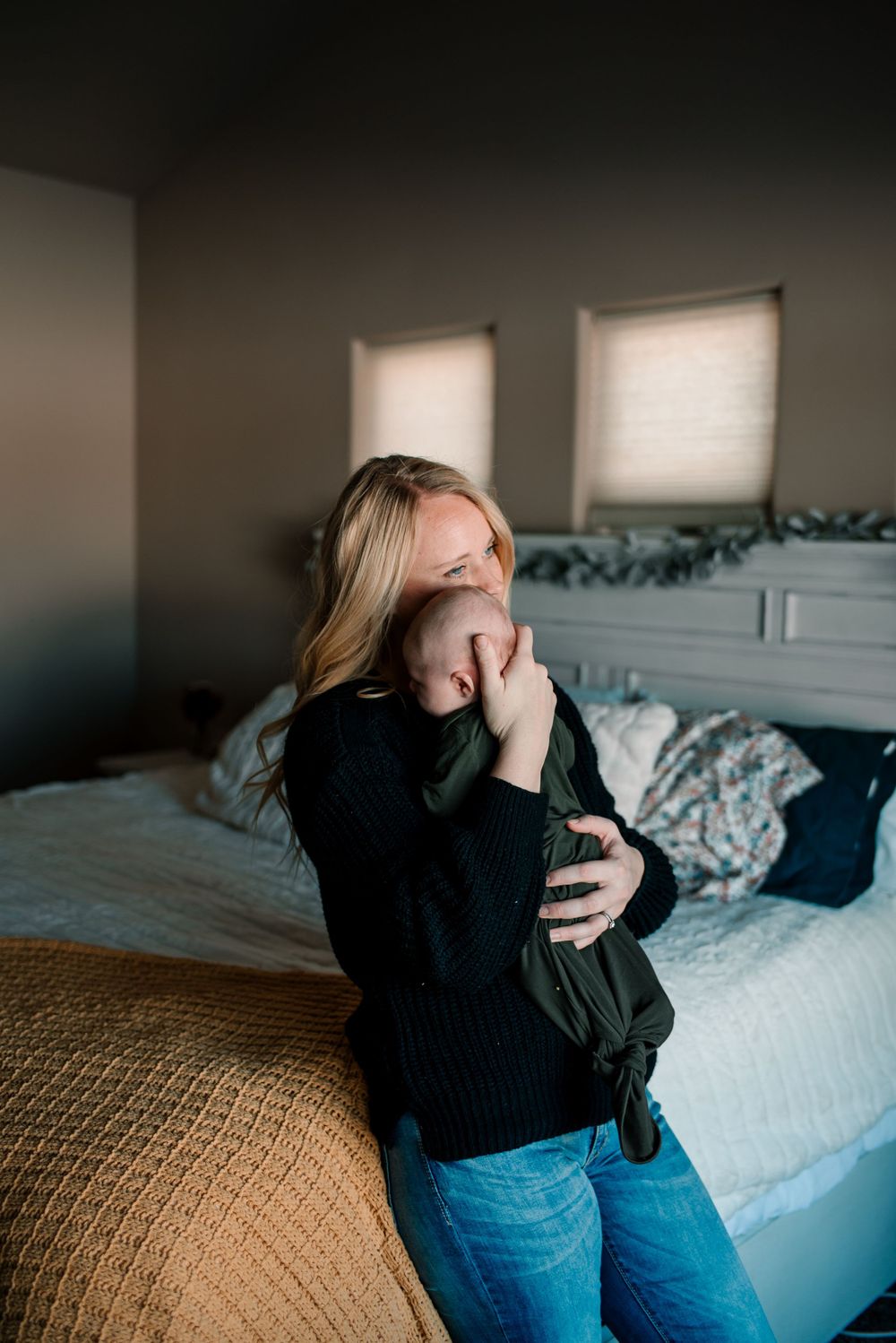 Natural light photography capturing candid moments between a couple at home.