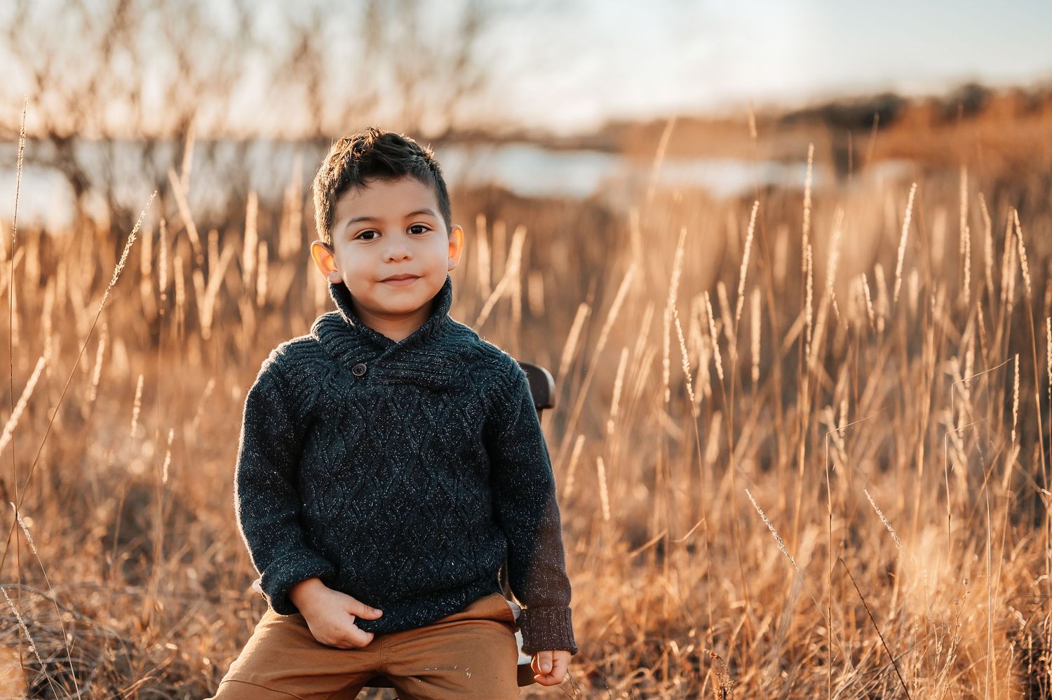 Boy looking at camera smiling during maternity photoshoot at Murrell Park.
