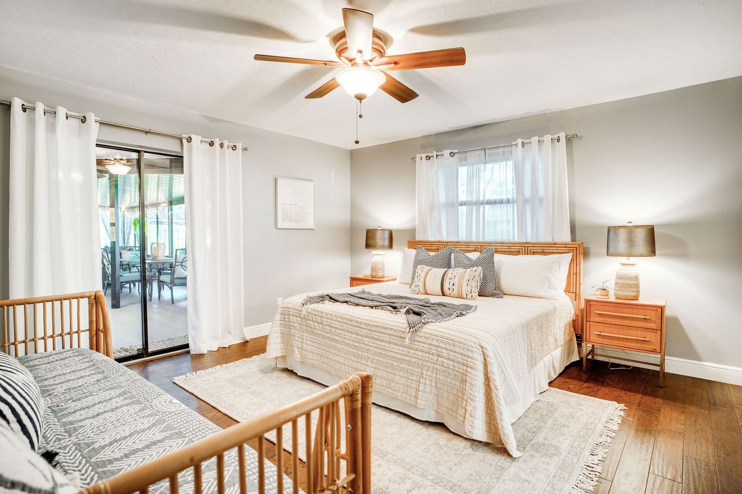 a professional real estate photo of a modern, well-decorated bedroom in a home in florida