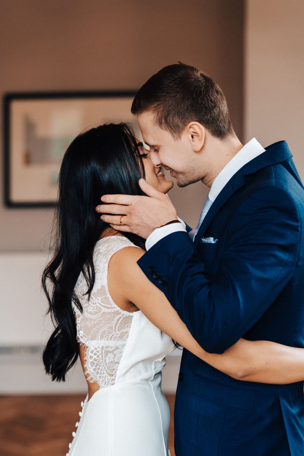 Bride and groom kissing for the first time at the ceremony