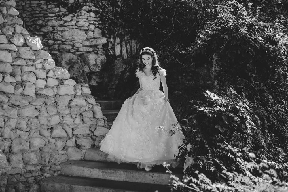 black and white girl going down stairs. japanese garden. San Antonio, Texas. wedding photographer