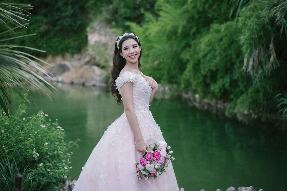 pink dress. flower bouquet. smiling. japanese garden. San Antonio, Texas. wedding photographer