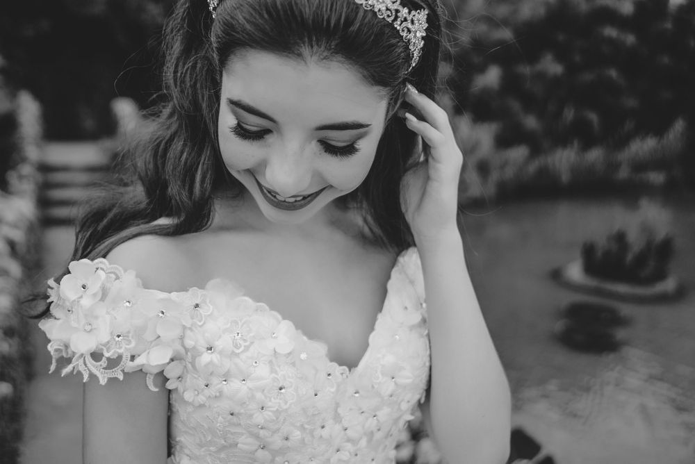 black and white girl looking down her shoulder. japanese garden. San Antonio, Texas. wedding photographer