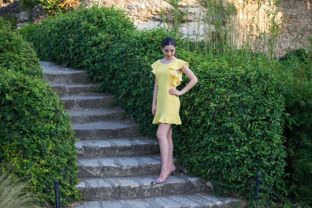 girl standing on stairs. yellow dress. Japanese garden. San Antonio, Texas. wedding photographer