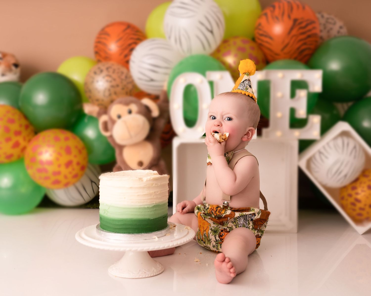 Baby boy at his cake smash photographed by cake smash photographer swansea