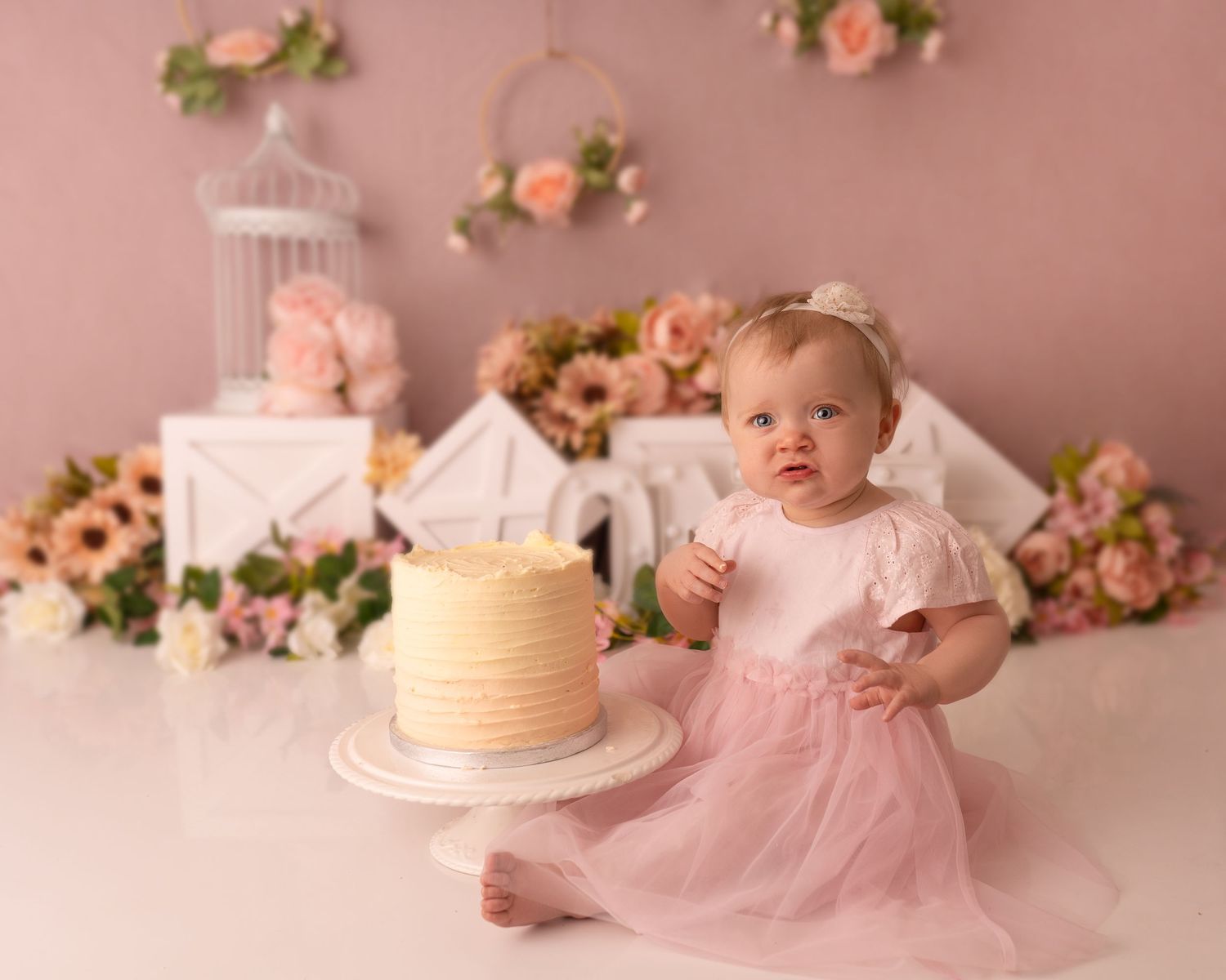 Baby girl at her cake smash photographed by cake smash photographer swansea