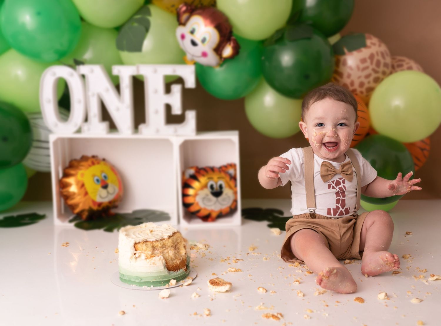 Baby boy at his cake smash photographed by cake smash photographer swansea