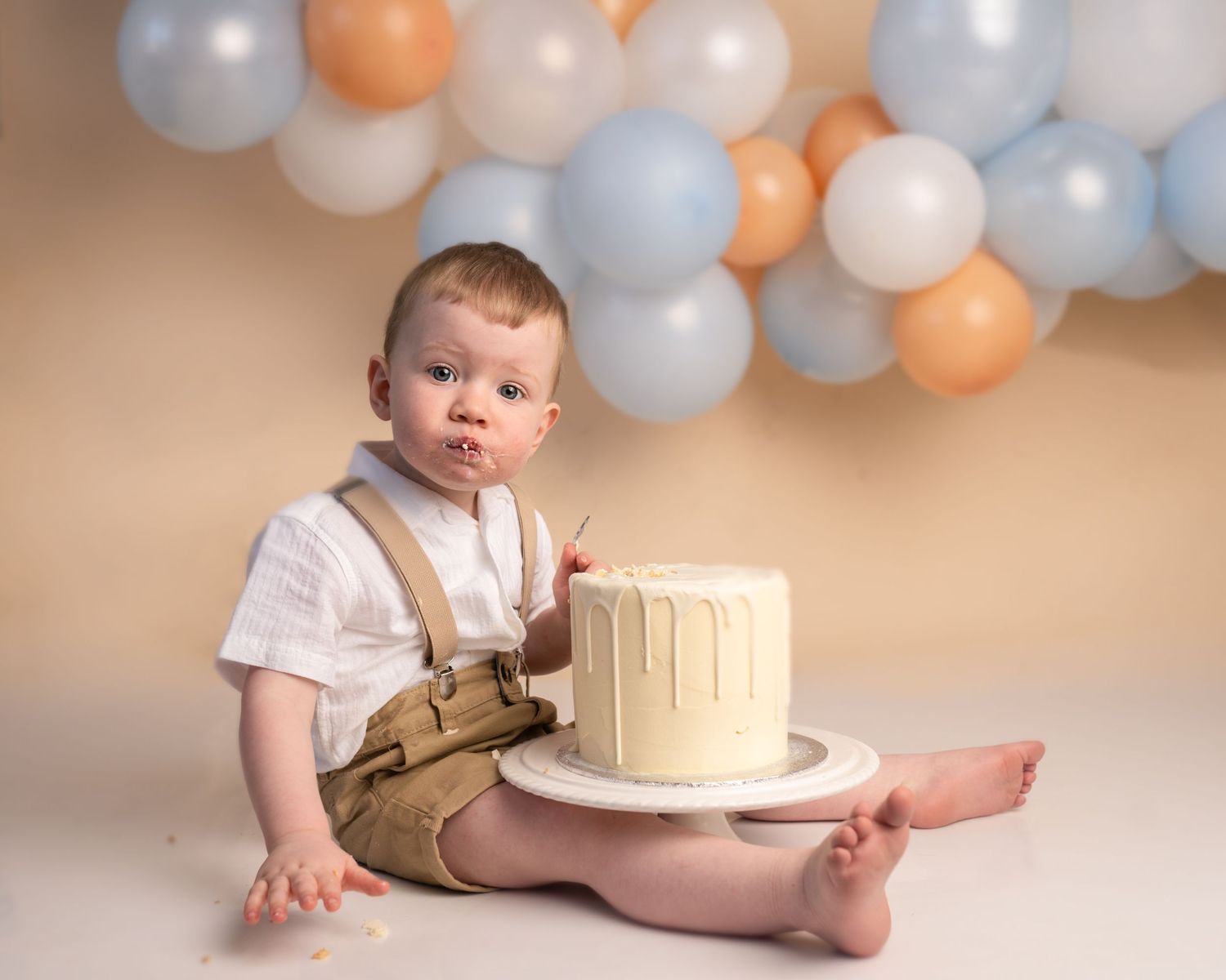 Baby boy at his cake smash photographed by cake smash photographer swansea