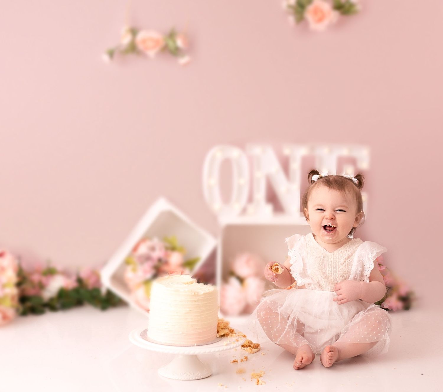 Baby girl at her cake smash photographed by cake smash photographer swansea