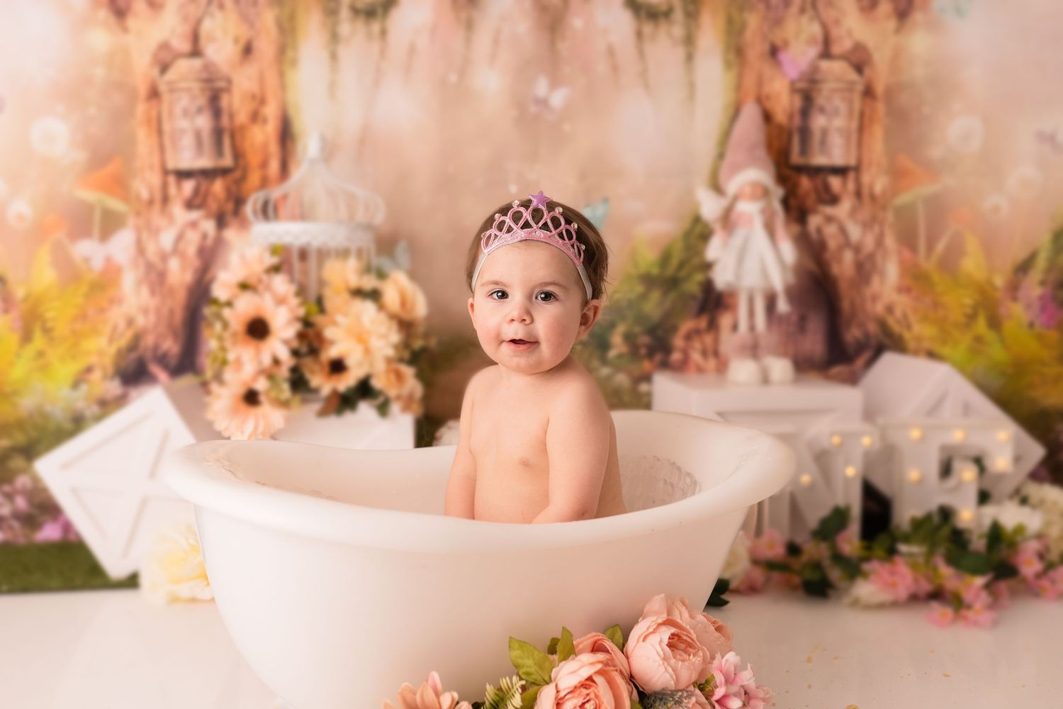 Baby girl in bath at her cake smash photographed by cake smash photographer swansea