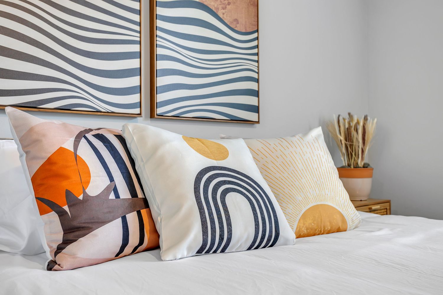 Color decorative pillows on bed