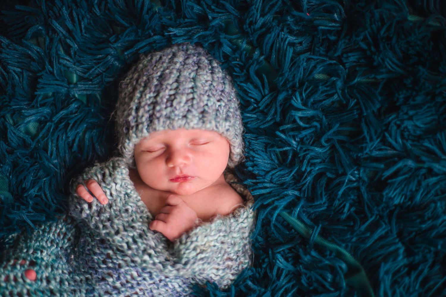 newborn boy pose natural light photography studio session wrap custom creative set memory captured Alabama Baldwin county sleeping crochet