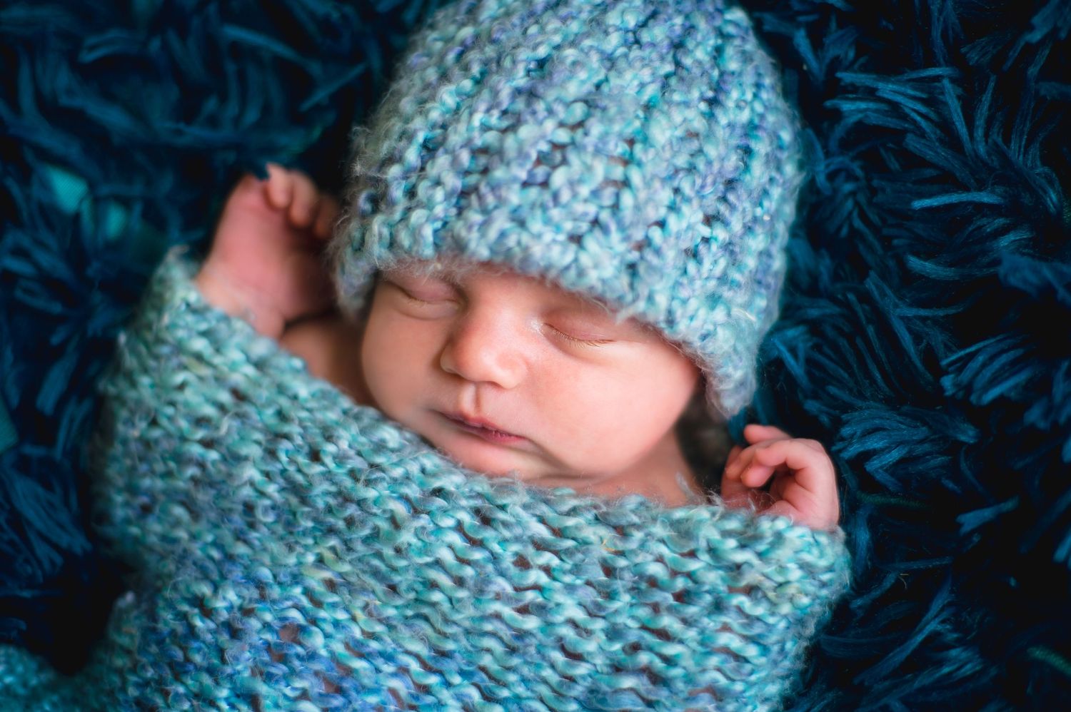 newborn boy pose natural light photography studio session wrap custom creative set memory captured Alabama Baldwin county sleeping